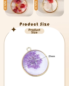 Macro detail of round resin pendant with gold metal rim and dried purple flowers