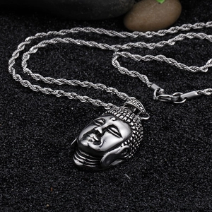 Silver stainless steel Buddha head pendant with twisted rope chain on zen stones