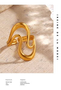 Artistic wavy 18K gold plated ring on textured stone surface with aesthetic shadows