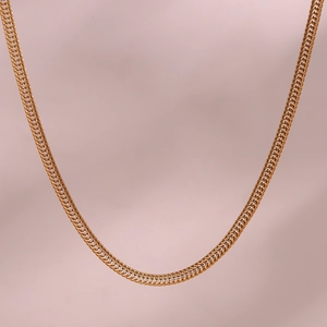 Macro detail of 3mm 18K gold-plated stainless steel foxtail chain showing intricate weaving