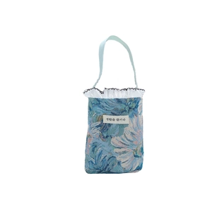 Vintage blue floral jacquard mini handbag with white lace trim and enjoy life label