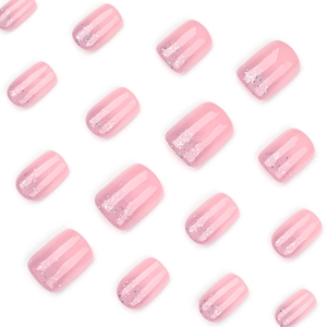 Short square press-on nails with pink glitter gradient and silver shimmer accents