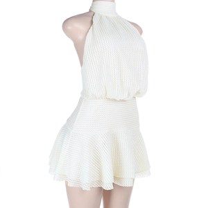 Detailed macro view of cream white textured mesh fabric on backless halter neck dress