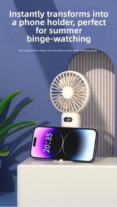 Portable mini fan with phone holder base for desktop cooling and watching