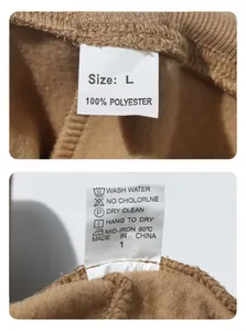 Detail view of the garment care label showing 100% polyester material and size L for cargo pants