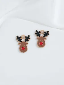 Detailed macro of festive elk charms with colorful oil drip enamel and gold metal finish