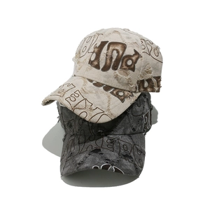 Distressed vintage baseball caps in beige and dark grey with street style lettering print
