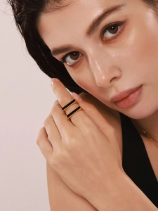 Detail of 18K gold plated double-layer geometric ring on model with black acrylic insert