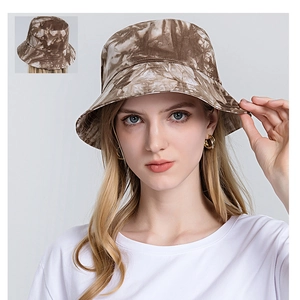 Close-up of tan marble tie-dye pattern and brim detail on a cotton fisherman bucket hat