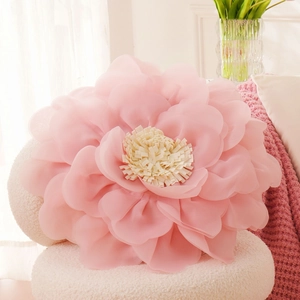 Detail of pink flower-shaped pillow cover featuring 3D multilayered petal design