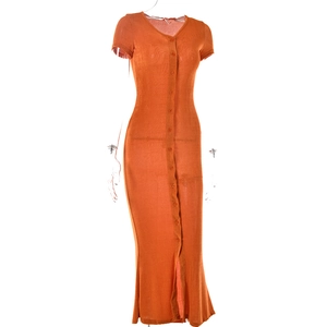 Detail of V-neck button-down orange maxi dress showing thin breathable knit texture