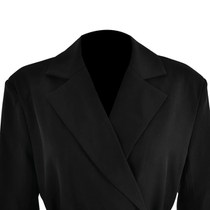 Detail shot of black long sleeve blazer with notch lapel design and smooth fabric texture