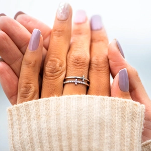 Detail of s925 silver double layer cross ring with shimmering cubic zirconia stones
