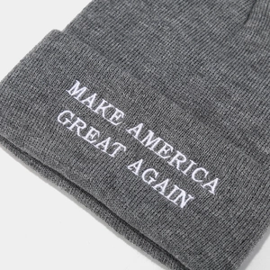 Gray knitted beanie with white Make America Great Again embroidery on the folded cuff
