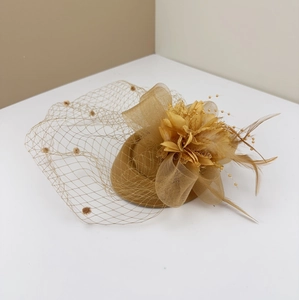 Elegant gold vintage wool felt fascinator hat with polka dot mesh veil and feathers