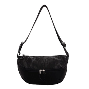 Macro view of bicolor crossbody bag showing marble print texture and durable dual zippers