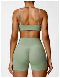 Vue arrière d'un ensemble de sport vert sauge taille haute avec détail froncé