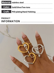 Detail of hollow heart rings in gold and silver finish with hand polishing texture