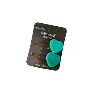 Set of two heart-shaped teal acetate hair clips with marble texture on bronze metal base