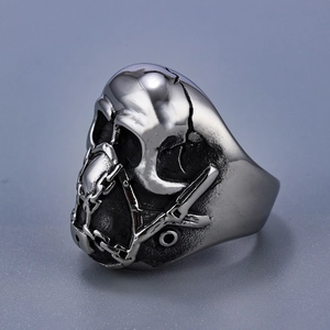 Close-up of gothic punk skull ring in vintage silver finish with industrial textures