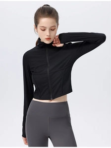 Detail of black slim fit yoga jacket featuring stand collar and zip-up cropped design