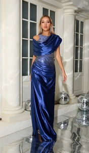 Detailed view of shimmering silver rhinestones on the starry blue satin evening dress