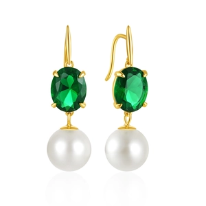 Close-up of elegant gold drop earrings with emerald oval stone and white pearl charms