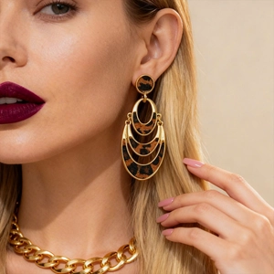 Golden multi-layer oval leopard print faux horsehair earrings on a blonde model