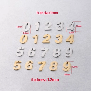 Flat lay of 0-9 gold and silver stainless steel number pendants with size measurements