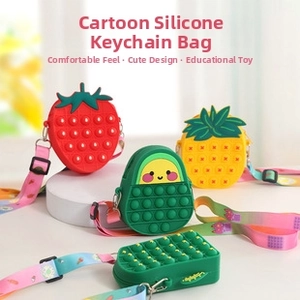 Assorted fruit-shaped silicone pop-it shoulder bags with colorful adjustable straps