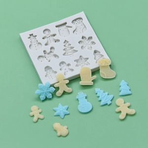 Christmas silicone mold set featuring snowman, tree, and snowflake patterns for DIY baking