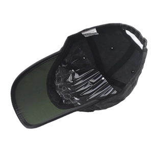 Detail view of cotton baseball cap interior with contrast visor and care label