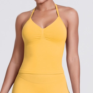 Detailed knit texture and halter V-neck design of this yellow seamless yoga sports bra