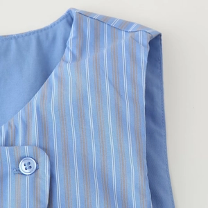 Blue striped sleeveless top and pants set with button detail and soft fabric texture