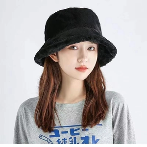 Chic black faux fur bucket hat for women in minimalist style for winter warmth