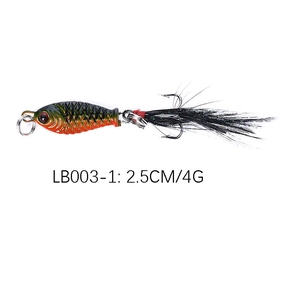 Detail of 4g 2.5cm micro metal lead fish lure with orange scales and feather treble hook