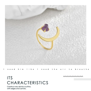Macro detail of crescent moon open ring with a raw purple amethyst stone inlay