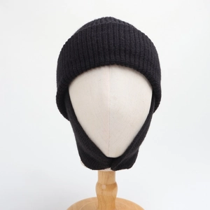 Detailed texture of black ribbed knit balaclava hat for kids with neck protection