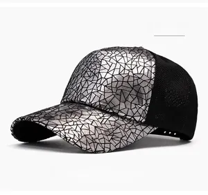 Close-up of silver sequin baseball cap with geometric patterns and black mesh detail