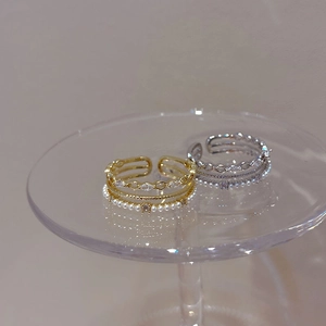 Three-layer open ring with pearls and micro-pave cubic zirconia in gold and silver
