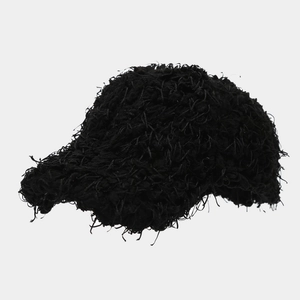 Detail of black baseball cap with distressed fuzzy texture and raw edge street style