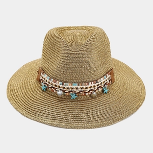 Bohemian straw Panama hat with shiny metallic gold weave and starfish shell decor