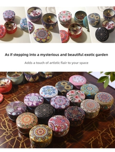 Detailed view of soy wax candles in mandala patterned ethnic style decorative tin cans