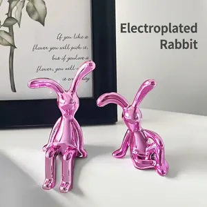 Set aus rosa galvanisierten Hasenfiguren für moderne minimalistische Heimdekoration