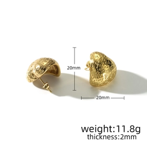 Detail showing 20mm gold domed earrings with hammered texture and 2mm thickness specs