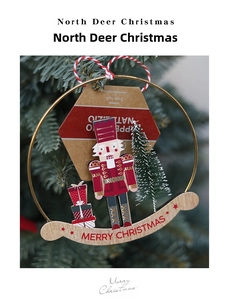 Detail of Nutcracker Christmas ornament with a gold ring and Merry Christmas wood base