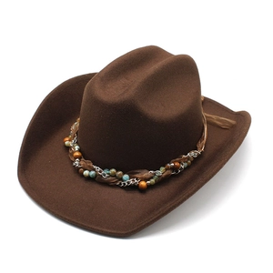 Brown wool felt cowboy hat with bohemian beaded band and turquoise accents on white background