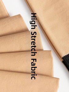 Close-up of high-count knit fabric and black patchwork edge on skin-tone tights
