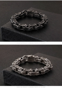 Macro shot of 316L stainless steel vintage silver bracelet with etched totem patterns