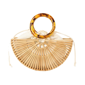 Handmade semi-circle bamboo woven handbag with amber resin handles and white inner pouch